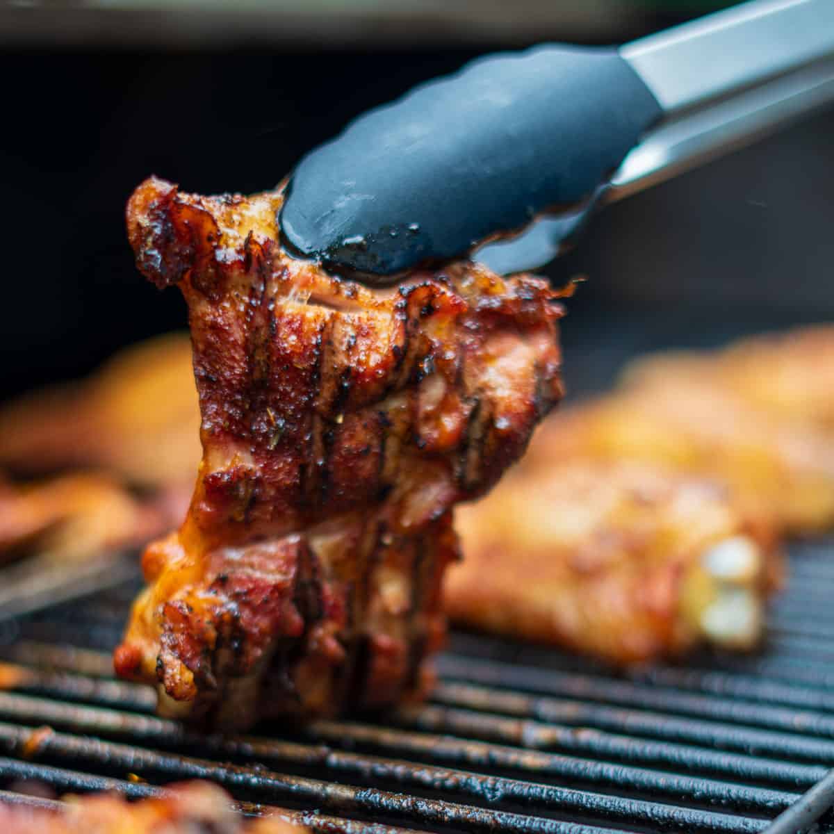 Sliced smoked chicken thigh — a great topping for smoked baked potatoes