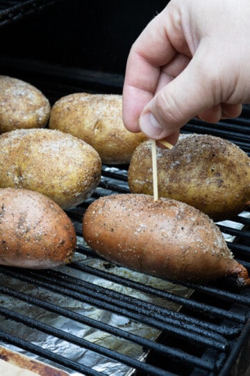 checking doneness of baked potato with toothpick