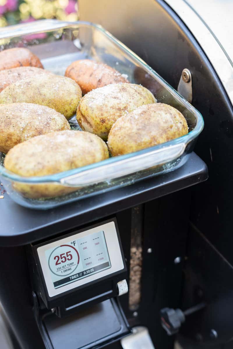 Seasoned russet potatoes ready to smoke at 225°F on a Camp Chef pellet smoker