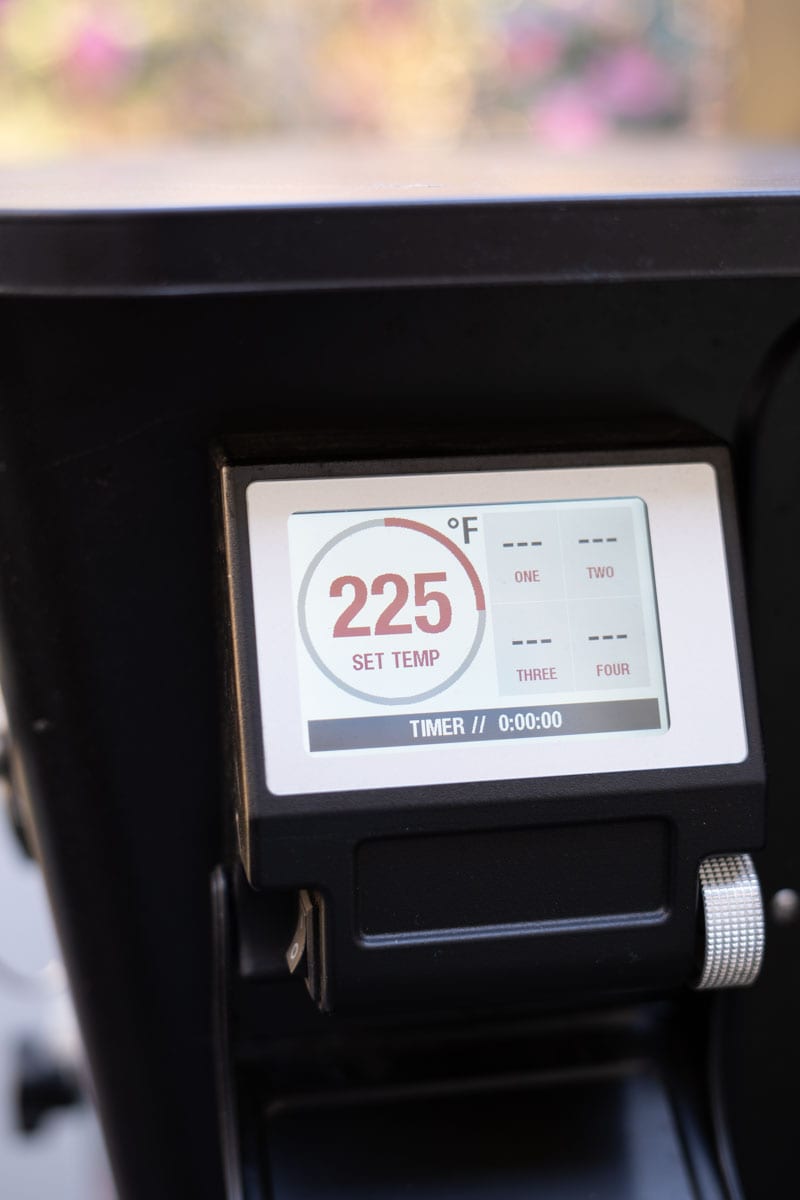 Pellet smoker temperature screen set to 225°F for smoking baked potatoes