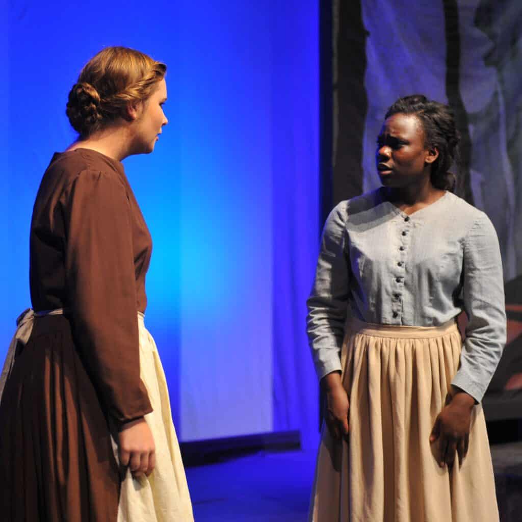 A fall musical theatre production of Opal, two students speaking on stage