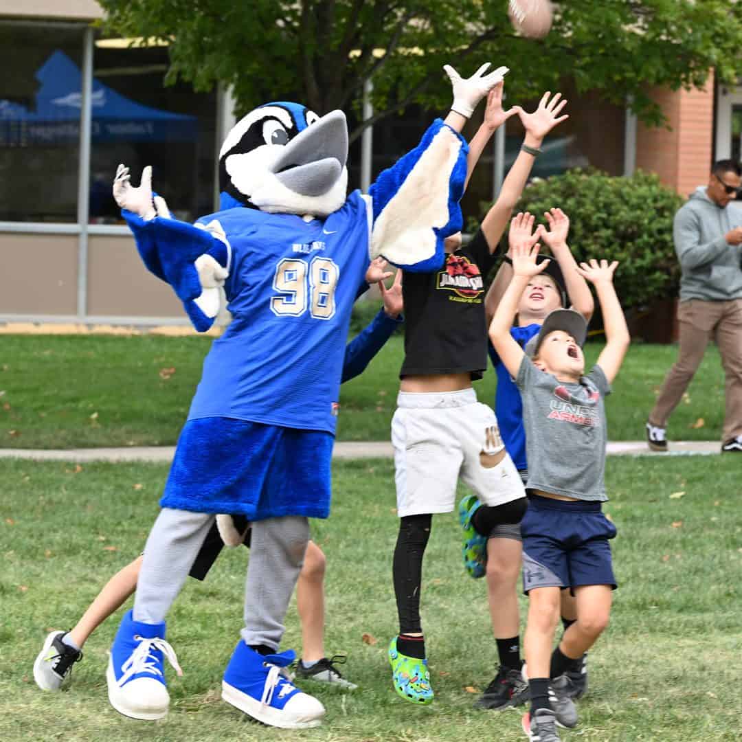 Mascot & Students at Kid Celebration at Homecoming