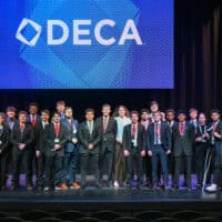 Tabor DECA students take a group picture after competing in business competition