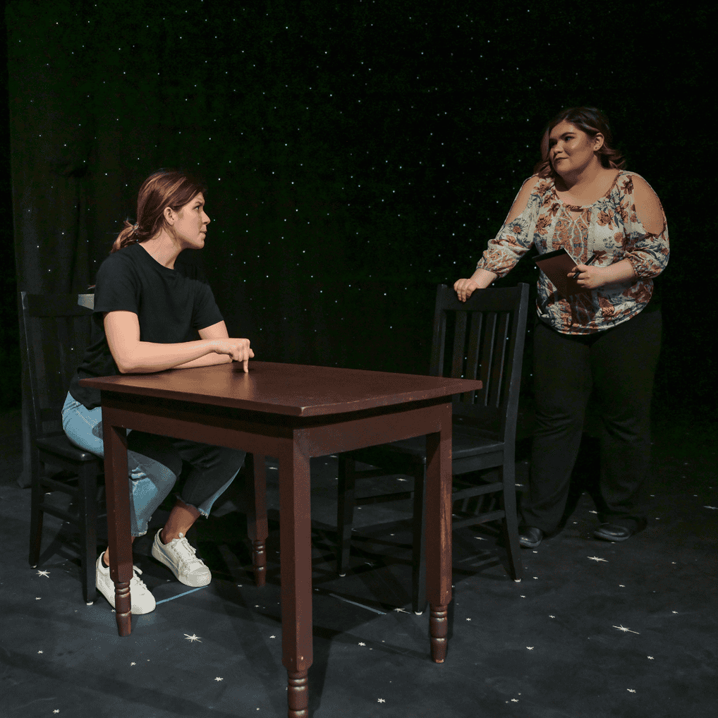 Night Sky spring theatre production with two students sitting and standing 