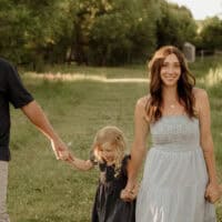 Jessica and David Toevs take a family photo with their children