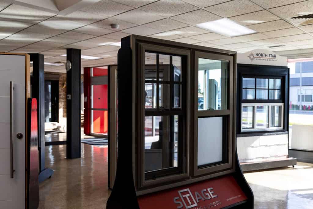 Showroom window display featuring various window styles at Tamar Building Products.