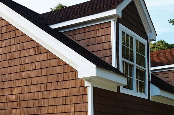 Exterior siding with Tamar Building Products' durable wood shingles and panels.
