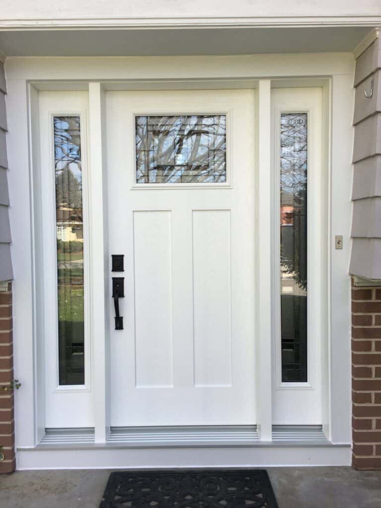 Front door with sidelights, modern design, and durable materials from Tamar Building Products.
