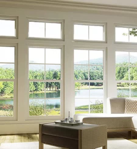 Large white window with scenic outdoor view in a bright living room.