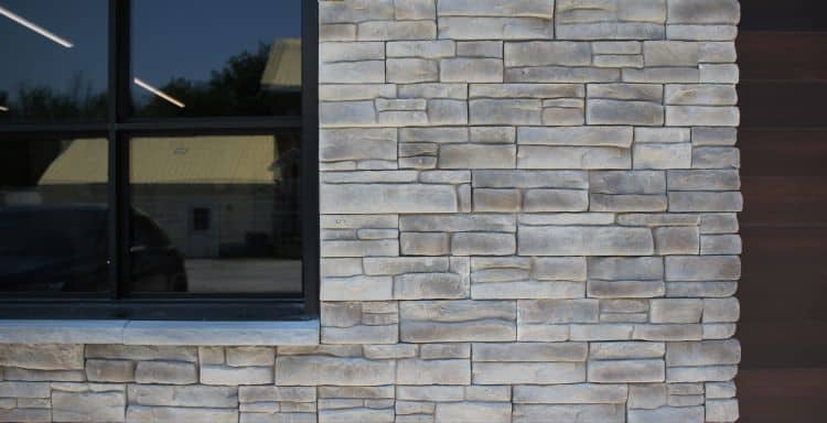 Stone cladding wall with natural textures and neutral tones for building facades.