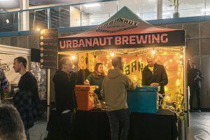 Bold urbanart brewing stall at Taranaki Beer Festival NZ, lively craft beer sampling.