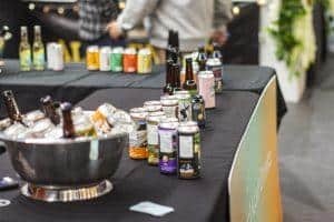 Assorted craft beers and soda cans at Taranaki Beer Festival in New Zealand.