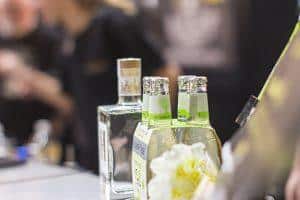 Cold craft beer bottles at Taranaki Beer Festival, showcasing local New Zealand brews and lively beer tasting experience.