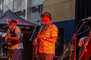 Live band performing at Taranaki Beer Festival, showcasing craft beers and local music in New Zealand.