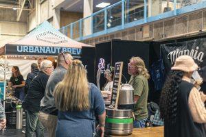Urbanut Brew beer festival at Taranaki Beer Festival in New Zealand, showcasing local craft breweries and beer enthusiasts.