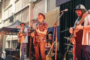 Vibrant band performing live at Taranaki Beer Festival, showcasing local craft beers and live music in New Zealand.