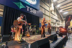 Live music at Taranaki Beer Festival featuring local bands and craft beer stalls.