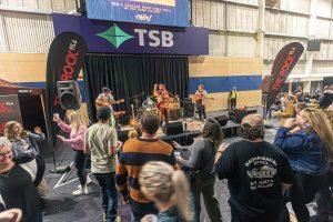 Live music at Taranaki Beer Festival, NZ with crowd enjoying entertainment and craft beers.