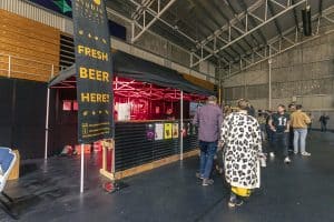 Fresh beer stall at Taranaki Beer Festival, showcasing local craft brews in New Zealand.