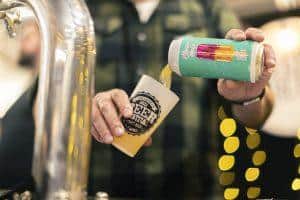 Refreshing craft beer pouring at Taranaki Beer Festival in New Zealand.