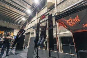 Fast-paced beer festival event with participants competing in a hang-time challenge, showcasing vibrant craft beer culture in Taranaki.