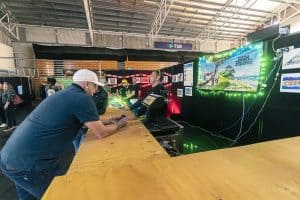 Vibrant scene at Taranaki Beer Festival with beer enthusiasts enjoying craft brews and live entertainment.