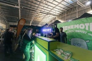 Brewery stall at Taranaki Beer Festival showcasing craft beers and local brewing brands.