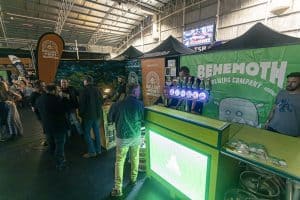 Brewery booth at Taranaki Beer Festival, showcasing craft beers from Ballast Point Brewing and Behemoth Brewing.