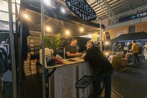 Vibrant beer festival scene at Taranaki Beer Festival, showcasing local craft beers and lively social atmosphere.