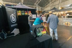 Craft beer tasting at Taranaki Beer Festival in an indoor venue.