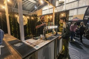 Refreshing craft beers being served at Taranaki Beer Festival, featuring local brewers and vibrant atmosphere.