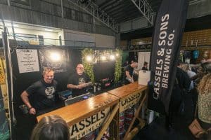 Cassels Brewing Co stall at Taranaki Beer Festival featuring local craft beers and lively atmosphere.