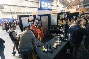 Craft beer tasting at Taranaki Beer Festival with diverse breweries and local attendees enjoying the event.