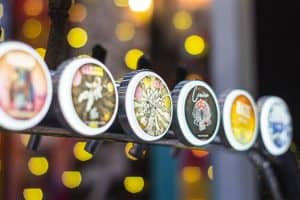 Colourful craft beer cans at Taranaki Beer Festival, showcasing NZ craft brews and vibrant beer culture.