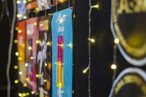 Colourful beer festival posters with string lights at Taranaki Beer Festival, New Zealand.
