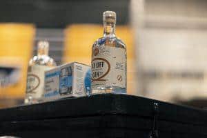 Vegan gin bottle at Taranaki Beer Festival, New Zealand, showcasing craft spirits and local brews.