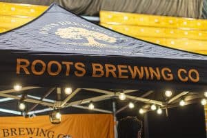 Roots Brewing Co tent at Taranaki Beer Festival, showcasing local craft beer and vibrant festival atmosphere, perfect for beer enthusiasts in New Zealand.