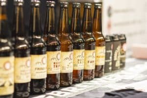 Bottles of craft beer at the Taranaki Beer Festival, showcasing a variety of local and international brews.