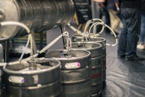 Keg tapping station at Taranaki Beer Festival, showcasing craft beer in New Zealand.