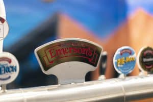 Emerson's beer tap at Taranaki Beer Festival, showcasing popular craft beer brands in New Zealand.