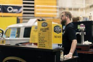 Bright yellow Good George Brewing Co drinks menu at Taranaki Beer Festival, showcasing popular craft beers.