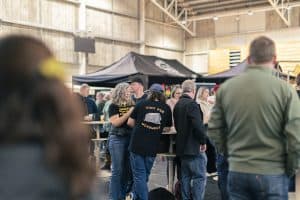 Taranaki Beer Festival attendees enjoying craft beers at indoor event in Taranaki, New Zealand.