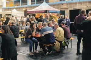 Urban Art Brewing Taranaki Beer Festival with indoor seating and craft beer tastings, lively atmosphere at the Taranaki Beer Festival.