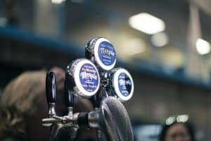 Neon Moon Manaia craft beer tap handles at Taranaki Beer Festival, showcasing NZ craft beers.