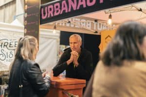 Craft beer vendors at Taranaki Beer Festival, showcasing local and craft beers in a lively outdoor setting.