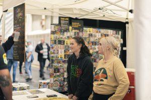 Taranaki Beer Festival visitors enjoying craft beers at the festival.