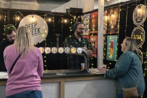 Craft beer tasting at Taranaki Beer Festival featuring local brewers and vibrant atmosphere.