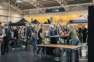 Craft beer and local brews at Taranaki Beer Festival in a bustling indoor venue.