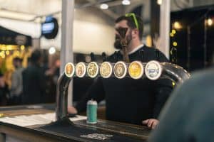 Fresh craft beer on tap at Taranaki Beer Festival, showcasing local brews in New Zealand.