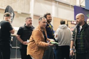 Fresh craft beer tasters at Taranaki Beer Festival, showcasing local brews and lively social atmosphere in New Zealand.